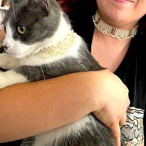 Matching antique necklaces for owner and cat pearl